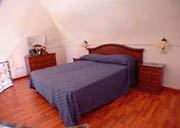 Dwelling in Positano: Bedroom on the mezzazine floor of the Dwelling Ludovica Type C in Positano
